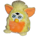 orange and yellow furby. he looks delighted